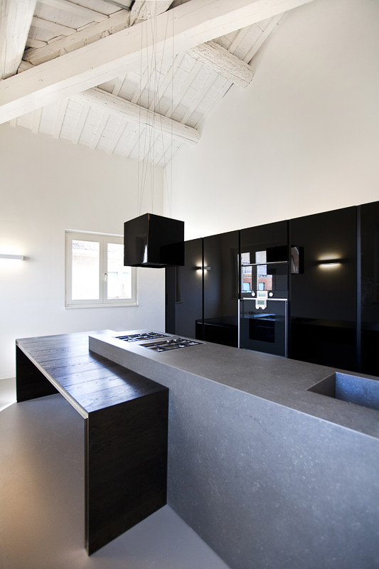 Black kitchen and concrete kitchen for a loft