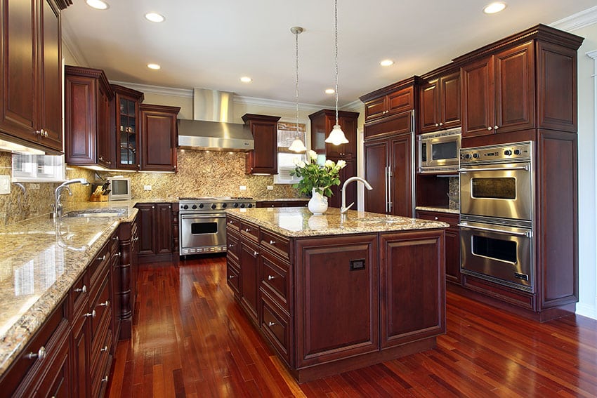 Kitchen in luxury home with cherry wood cabinetry