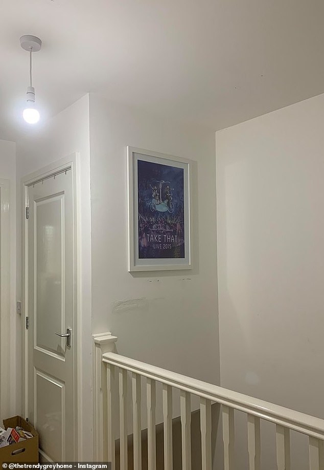 BEFORE: The landing before the make over, with just a Take That poster above the stairs