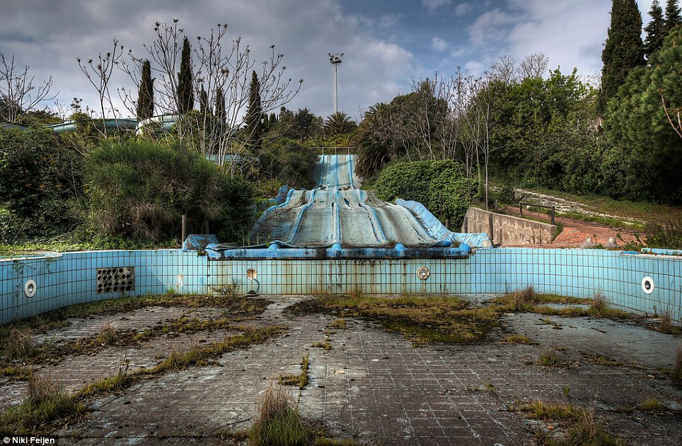 Water world: In his travels, Feijen has come upon this abandoned water park with a slide draining into an empty pool overgrown with vegetation