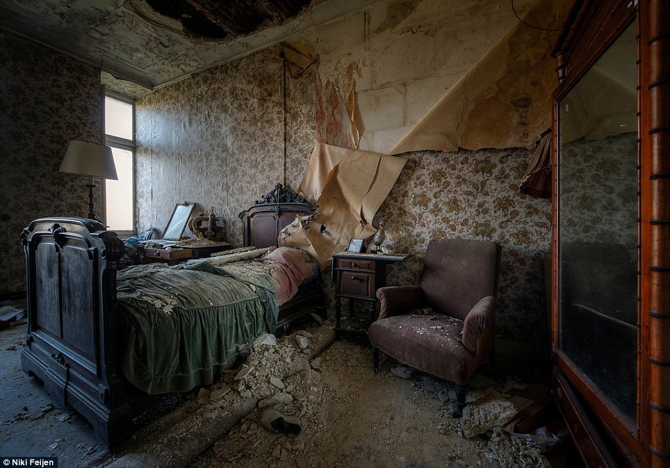 Exploring decay: Dutch photographer Niki Feijen has traversed the world looking for crumbling beauty lurking beneath a thick layer of dust inside private bedrooms and public buildings