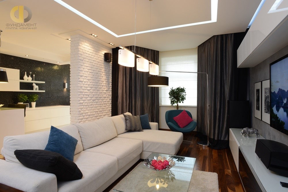 Современный стиль в интерьере гостиной с угловым диваном
